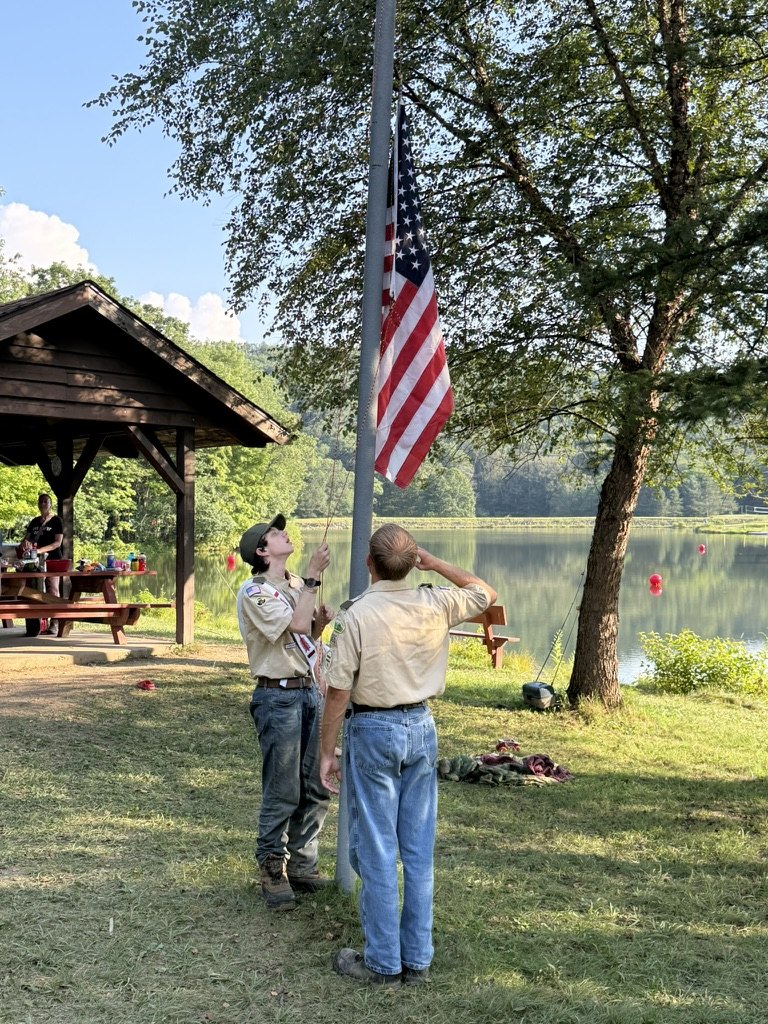 Scouts raising a flag